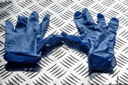 Photo for Protective gloves on steel plate - Royalty Free Image