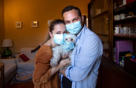Photo for Happy couple wearing masks at home - Royalty Free Image