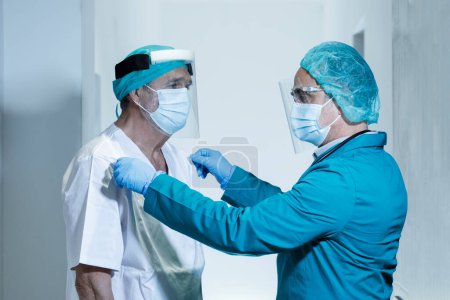 Photo for Portrait of two confident doctors wearing protective masks - Royalty Free Image