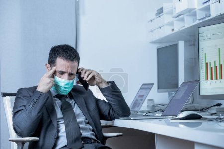 Photo for Businessman in the office is forced to work with the mask to avoid getting sick and being infected by the virus - Royalty Free Image