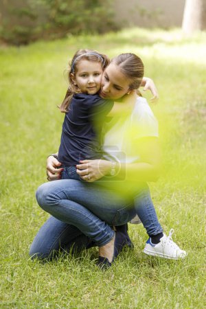 Photo for Mother and daughter in the backyard - Royalty Free Image
