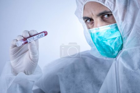Photo for Researcher looking for solutions to cure coronavirus, isolated on light background - Royalty Free Image