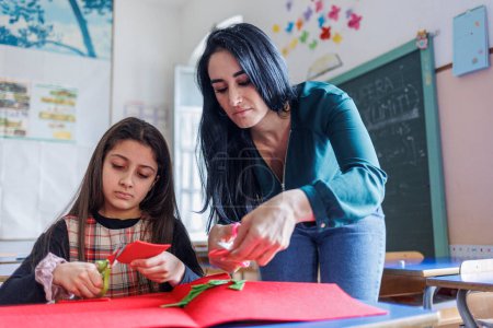 Photo for A teacher carries out educational activities with a pupil at school - Royalty Free Image