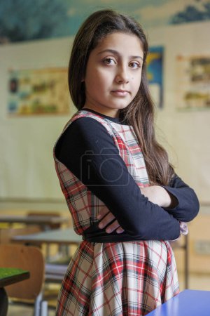 Photo for Portrait of an adorable little girl in the school - Royalty Free Image