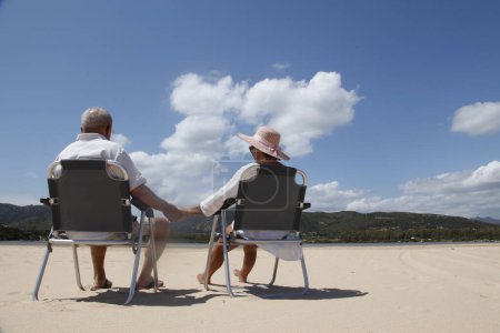 Photo for Elderly couple sitting on chairs - Royalty Free Image