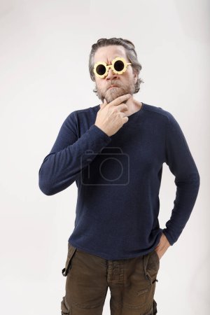 serious nordic man with funny sunglasses