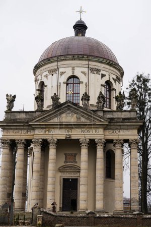 Photo for Baroque Roman Catholic church of St. Joseph mid 18th century. Latin on main facade - TO THE GLORY OF OUR LORD GOD, Pidhirtsi, Lviv Oblast, Ukraine. - Royalty Free Image