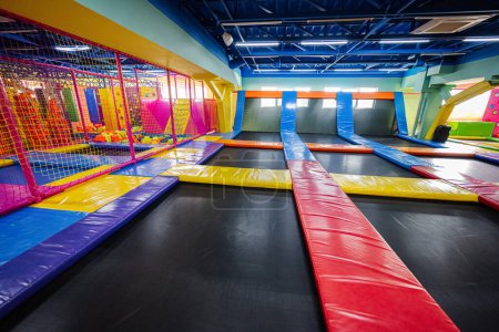 Set of trampolines at indoor play center playground. 
