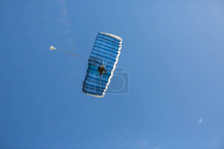 Photo for Two-person parachute descent seen from below - Royalty Free Image