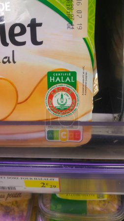Photo for Villefranche-sur-Saone, France - July 2019 - Halal chicken on shelf : "Halal certified by the Muslim Institute of Paris Mosque and the French Society for the Control of Halal meat and foods" - Royalty Free Image