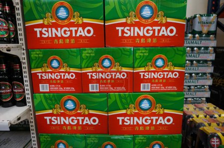 Photo for Toulouse, France - July 2019 - Stockpile of cases of beer from China, produced by the well-known beverage brand TsingTao from the city of Qingdao, for sale in the Asian supermarket Paris Store - Royalty Free Image