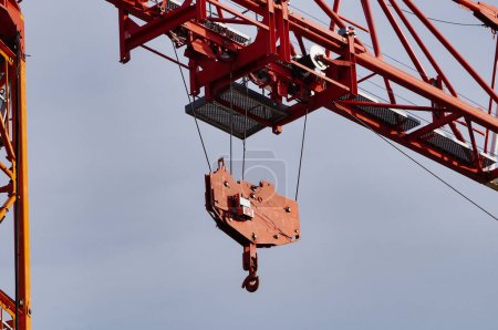 Photo for Reims, France - Oct. 2022 - Detail of a construction crane from the French manufacturer Potain, featuring the hook, the pulley system and the mobile carriage, which is track-mounted on the main boom - Royalty Free Image