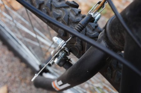 Photo for Detail of the mechanism of a shoe brake mounted on a mountain bike ; the system is composed of pads pressing the rim, actuated by brake calipers connected to the cable noddles (linear-pull - Royalty Free Image