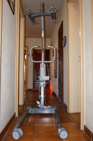 Photo for Albi, France - April 2020 - Medical equipment for home care : a modern lift for patient transfer, made in France by the American manufacturer Invacare, having an electrically controlled mechanical arm - Royalty Free Image