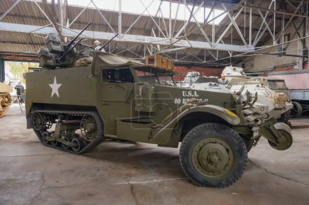 Photo for Troyes, France - Sept. 2020 - A heavily armed, American M3 armored personnel carrier half-track, featuring wheels in the front, tracks at the rear and equipped with a battery of four machine-guns - Royalty Free Image