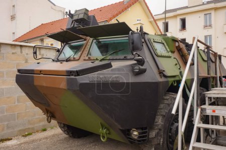 Photo for Troyes, France - Sept. 2020 - Front hood and bulletproof windshields of a khaki 66 VAB formerly used by the French Army, an armored personnel carrier (APC) manufactured by Renault Trucks Defense - Royalty Free Image