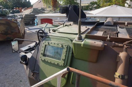 Photo for Troyes, France -Sept. 2020 - Top view over the front of a retired VAB, an armored personnel carrier manufactured by Giat for the French Army, featuring a thick bulletproof window and a rearview mirror - Royalty Free Image