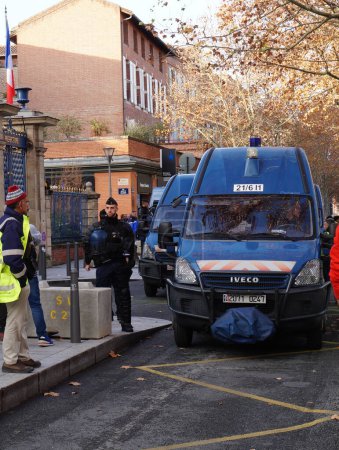 Photo for Toulouse, France -Saturday Dec. 14, 2019- Police cordon between Boulevard de Strasbourg and Jean Jaurs during Yellow Vests protests, with riot police officers - Royalty Free Image
