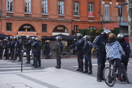 Photo for Toulouse, France -Saturday Dec. 14, 2019- Police cordon between Boulevard de Strasbourg and Jean Jaurs during Yellow Vests protests, with riot police officers - Royalty Free Image