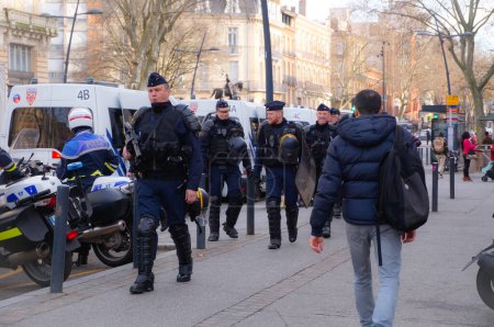 Photo for Toulouse, France - Feb. 2020 - Heavily equipped CRS (French SWAT units specialized in crowd control) officers in riot gear, blocking the access to the Capitole (city hall) during social protests - Royalty Free Image