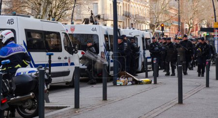 Photo for Toulouse, France - Feb. 2020 - Heavily equipped CRS (French SWAT units specialized in crowd control) officers in riot gear, blocking the access to the Capitole (city hall) during social protests - Royalty Free Image