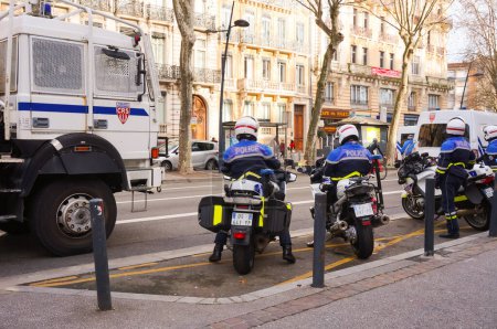 Photo for Jean-Jaurs, Toulouse, France - Feb. 2020 - Two motorcyclists of a CRS unit of the French National Police, riding BMW motorbikes - Royalty Free Image