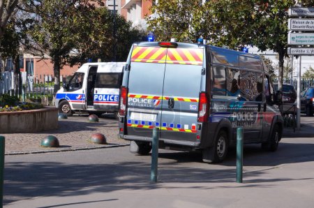 Photo for Toulouse, France - Feb. 2023 - Vans from the CRS (Republican Security Companies) of the National Police form a roadblock at Toulouse Capitole University, amid protests against the pension reform - Royalty Free Image