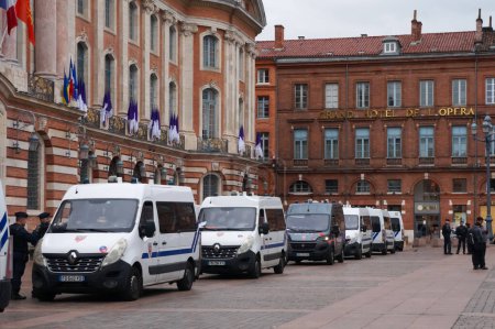 Photo for Toulouse, France - April 2023 - The city hall on Capitole Square is heavily guarded by CRS, the antiriot units with the French National Police, amid protests against the government's pension reform - Royalty Free Image