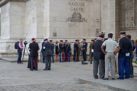 Photo for Paris, France - July 11, 2019 - Military ceremony around the Tomb of the Unknown Soldier under the Arc de Triomphe, with French officers and foreign representatives including the Military Ordinary - Royalty Free Image
