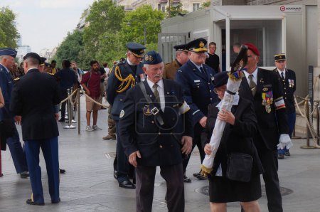 Photo for Paris, France - July 11, 2019 - Military ceremony around the Tomb of the Unknown Soldier under the Arc de Triomphe, with French officers and foreign representatives including the Military Ordinary - Royalty Free Image