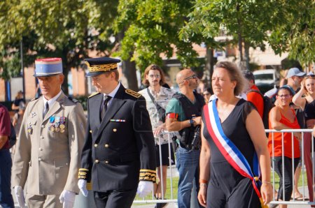 Photo for Albi, France - July 14, 2022 - Arrival of Tarn Prefect Franois-Xavier Lauch for the National Day military parade, with Mayor Stphanie Guiraud-Chaumeil and Army lieutenant-colonel Henri Sabrane - Royalty Free Image