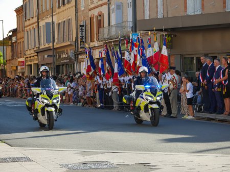 Photo for Albi, France - July 14, 2022 - Two CRS motorcyclists with the French "Police nationale", parading on the National Day's ("Bastille Day") military parade, passing past the veterans' standards - Royalty Free Image