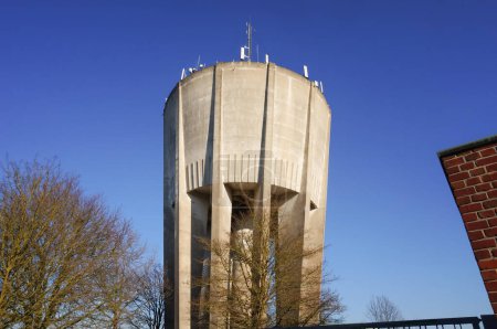Photo for A cup-shaped, concrete water tower on Janke Segal and Rouliers Street (Moulin de la Housse district), in Reims, France, topped with several telecommunications antennas for wireless Internet - Royalty Free Image