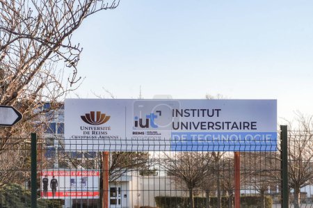 Photo for Reims, France - March 2021 - Fencing and signboards at the entrance of the University Institute of Technology (IUT) of Reims, which is part of the University of Reims-Champagne-Ardenne (URCA) - Royalty Free Image