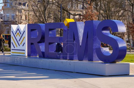Photo for Reims, France - Feb. 2022 - Logotype, in blue, giant, capital letters, of the City of Reims, on the Square of the Porte de Mars, at the end of the Hautes Promenades (Jean-Louis Schneiter Promenades) - Royalty Free Image