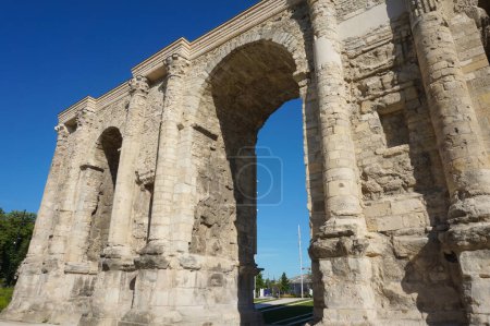 Photo for The Porte de Mars (Gate of Mars), a 3th century vestige, and an ancient Roman triumphal arch, located at the end of the Hautes Promenades, in Reims, in the Northeast of France - Royalty Free Image