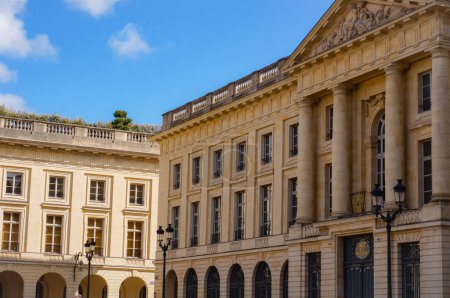 Photo for Reims, France - March 2021 - The main, classical facade of the 18th century palace that houses the sub-Prefecture of the Marne Department, featuring a triangular pediment, an arcade and four columns - Royalty Free Image
