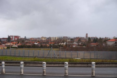 Photo for Albi, France - July 1, 2022 - Southwestern districts of Albi, seen from the ring road: Rayssac-Veyrieres on the left, Bon-Sauveur on the right; afar, the bell tower of Sainte-Cecile's Cathedral - Royalty Free Image