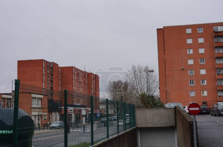 Photo for Albi, France - Jan. 2021 - Brick tower blocks of social housing in the priority neighborhood of Cantepau, an Islamized area with immigrant population known for drug trafficking and urban violence - Royalty Free Image