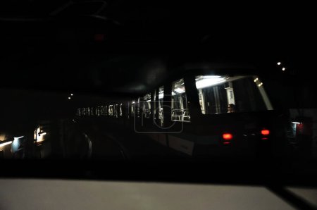 Photo for Paris, France - Sept. 2022 - Motion-blurred shot of a metro train, rolling inside an underground tunnel ; the interior of the train is lit, while the outside is dark, which creates a clair-obscur - Royalty Free Image
