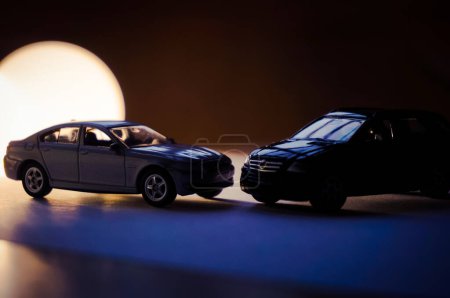 Photo for Silhouettes of two scale models of vehicles, clair-obscur effects - Royalty Free Image