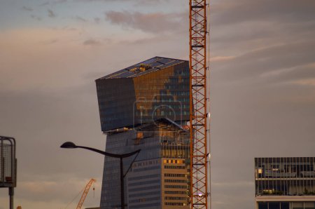 Photo for Paris, France - June 2021 - Construction site of the Tours Duo in the capital's 13th arrondissement, a set of two glass skyscrapers designed by the famous French architect Jean Nouvel, at sunset - Royalty Free Image
