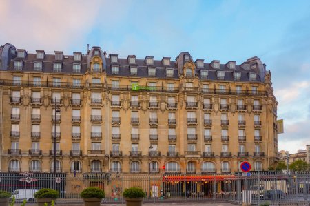 Photo for Paris, France - Sept. 2020 - Luxurious front facade of the Haussmann building of Holiday Inn, which houses a four-star hotel in front of the Gare de l'Est, one of Paris' main railway stations - Royalty Free Image