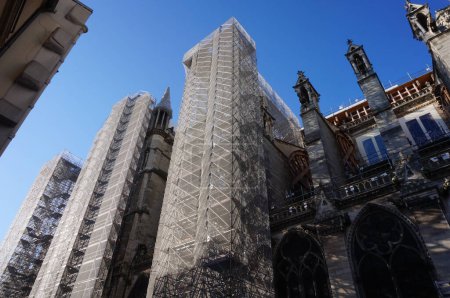 Photo for Paris, France - April 24, 2021 - Reconstruction site of the medieval Notre-Dame Cathedral, damaged by a fire in 2019 : here, the nave of the gothic building is flanked with huge scaffoldings - Royalty Free Image