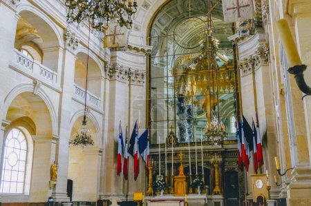 Photo for Paris, France - July 2019 - Inside the Cathedral Saint-Louis des Invalides, having an altarpiece decorated with French flags, a royal chapel now seat of the Military Ordinariate to the French Army - Royalty Free Image