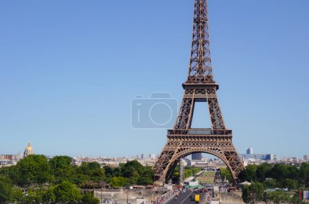 Photo for Paris, France - June 2019 - Panoramic view of Paris' skyline, dominated by the Eiffel Tower ; the perspective of Ina Bridge heads to the Military School (cole Militaire) via Champ de Mars Park - Royalty Free Image