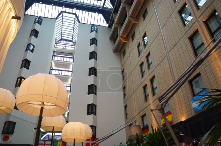 Photo for Vanves, France - Dec. 2023 - Low angle view in the atrium of Mercure Paris Porte de Versailles Expo, an upscale hotel belonging to French group Accor Hotels, near the exhibition and convention center - Royalty Free Image