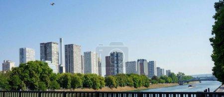 Photo for Paris, France - Towers, skyscrapers and buildings of the Front-de-Seine by the River Seine, seen from the bridge Pont de Grenelle - Royalty Free Image