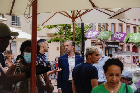 Photo for Toulouse, France - June 25, 2020 - Antoine Maurice, Archipel Citoyen's ecologist candidate for mayor of Toulouse and his staff chat with voters in the aftermath of at an outdoor election meeting - Royalty Free Image
