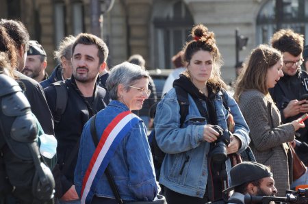 Photo for Paris, France - Nov. 2022 - Member of the National Assembly Sandrine Rousseau, wearing a tricolor sash, from the far-left political group NUPES, taking part in a demonstration against global warming - Royalty Free Image